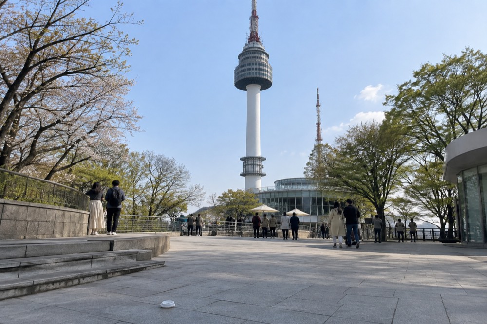 The open summit plaza around the base of N Seoul Tower with terraces and railings